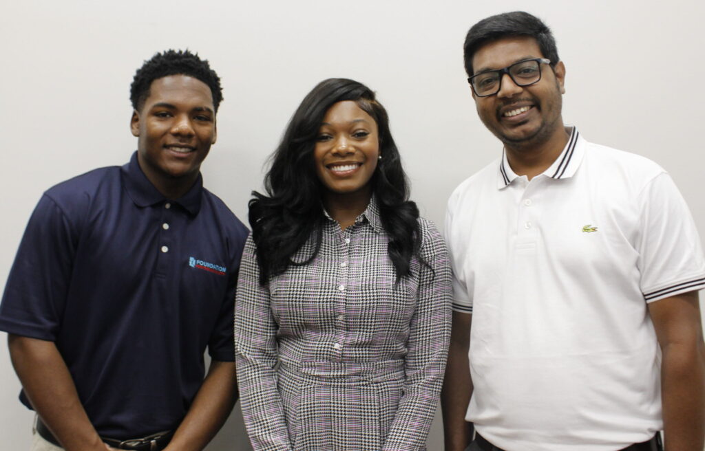 Foundation for the Mid South interns Adam Tolliver, Jamyiyah Cotten, and Faysal Ahmed Imran smiling together, representing the next generation of leaders in the Mid South.