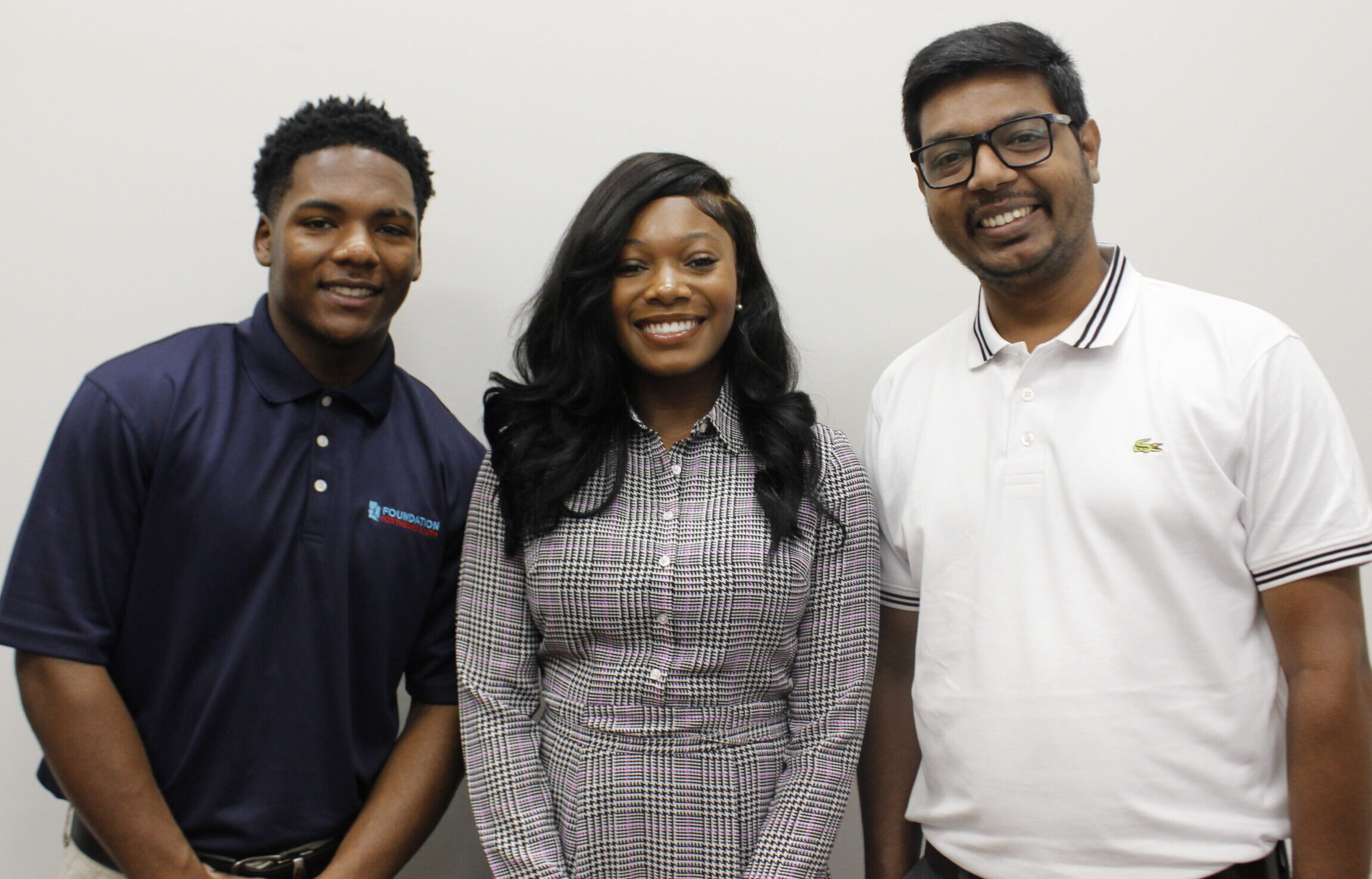 Foundation for the Mid South interns Adam Tolliver, Jamyiyah Cotten, and Faysal Ahmed Imran smiling together, representing the next generation of leaders in the Mid South.