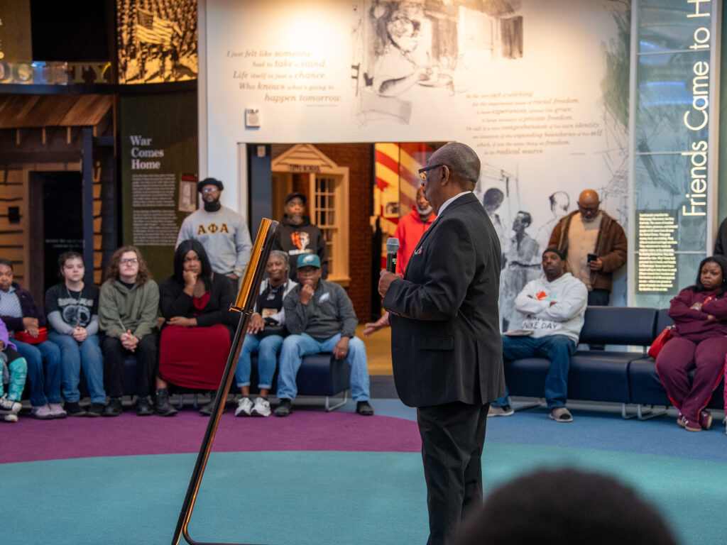 Civil rights veteran Hezekiah Watkins speaks to youth inside the Mississippi Civil Rights Museum on MLK Day.