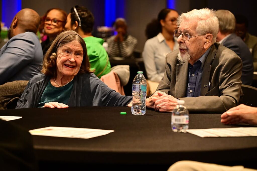 Rims Barber and Judy Barber seated together during Mississippi’s National Day of Racial Healing.