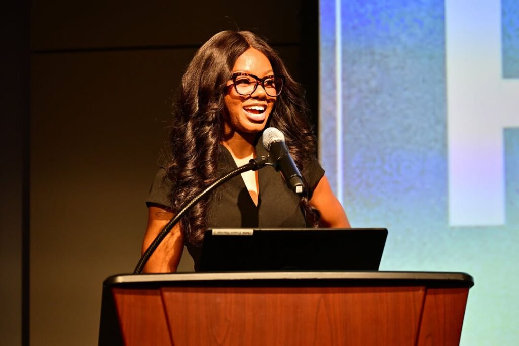 Derykah Watts speaks at the podium during Mississippi’s National Day of Racial Healing at the Two Mississippi Museums.